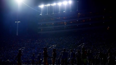 Stadium lights flash during the Victory Bell rivalry game between the USC and UCLA football teams